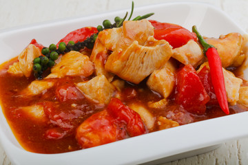 Pork with tomato and pepper