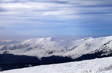 Winter mountains and cloudy sky