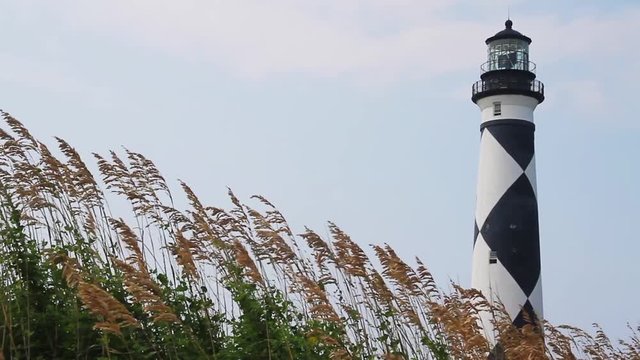 Loop features sea oats blowing in breeze and the Cape Lookout Lighthouse shining brightly atop its brick tower painted with black and white diamonds.