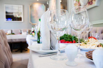 Restaurant table with glasses and napkins