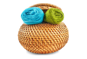 Wicker box of yellow color with dark blue and green thread