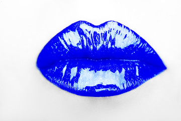 Close-up of woman's lips with bright fashion  blue  glossy makeup
