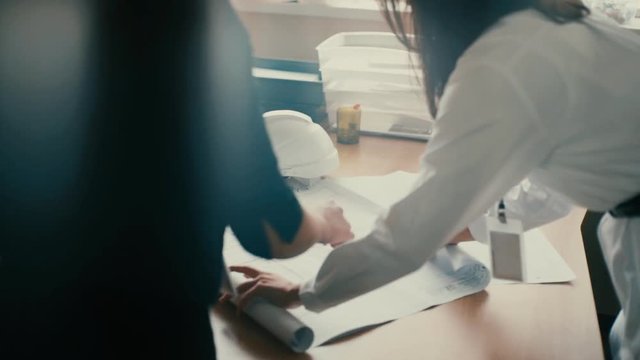 Two architects working together in office