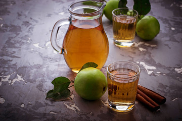 Glasses with apple juice on wooden table