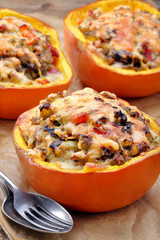 Autumn stuffed pumpkin with rice and mushrooms
