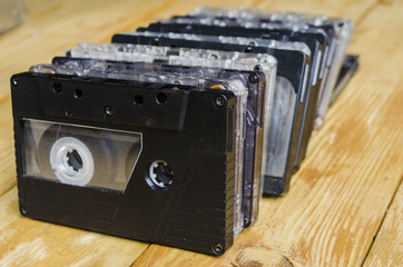 the cartridge for the tape recorder on a wooden table