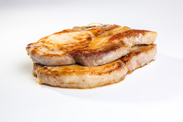 Two pieces of fried pork loin on a white background. Not isolate