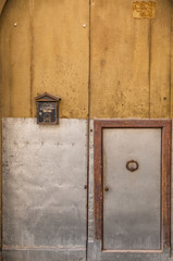 Large and heavy door. Small and light door. Letter box, studs, rust, swing.