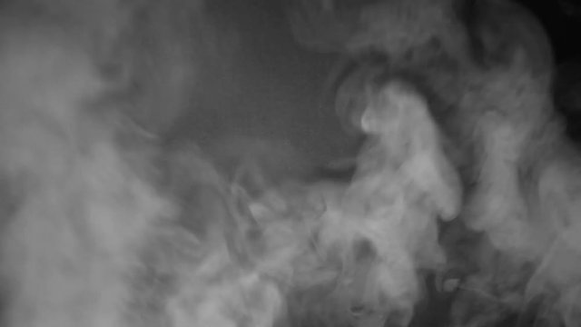 White smoke billows over a black background. HD 1080.