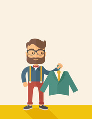 Happy young man chooses a perfect clothe.