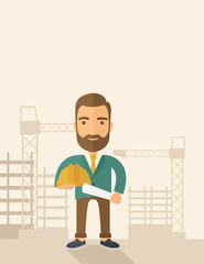 Young construction worker holding hard hat and blueprint.