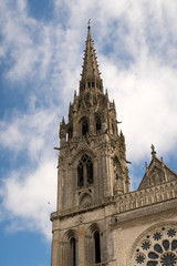 Fototapeta na wymiar Chartes Cathedral Tower with clouds