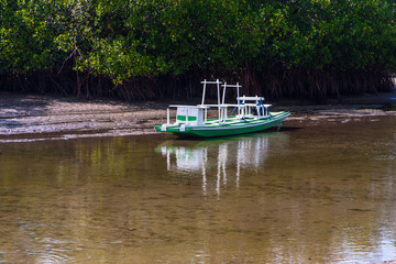 Fototapeta na wymiar A boat moored to the riverbank.