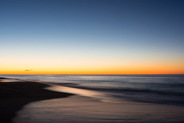 Fototapeta na wymiar The sun rises across the Atlantic Ocean from east Long Island, New York