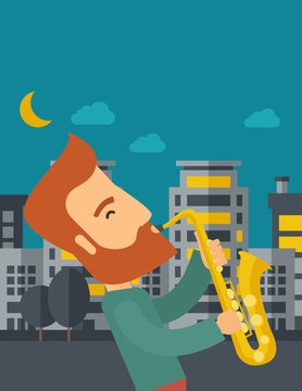 Saxophonist playing in the streets at night