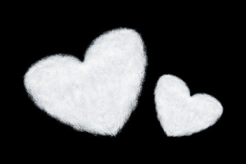 two heart shaped clouds isolated on black