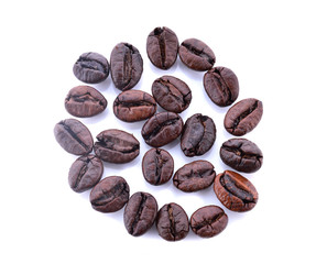 Shot from above handful pile of the roasted coffee beans isolate