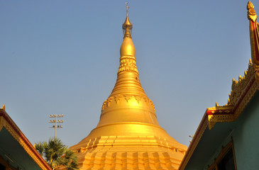 Fototapeta premium Golden stupa in Global Vipassana temple in Mumbai City, India.