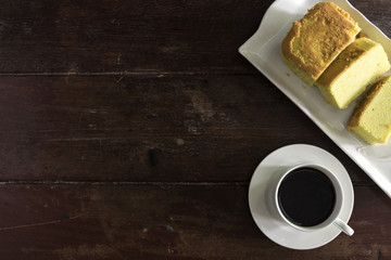 Coffee cup and saucer with cake