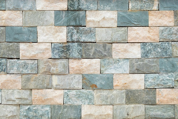 Green and orange Stone ceramic Brick wall beautiful color texture background for art interiors design in home, house, building, shop, store, art store, coffee shop