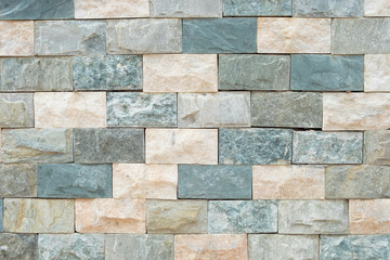 Green and orange Stone ceramic Brick wall beautiful color texture background for art interiors design in home, house, building, shop, store, art store, coffee shop
