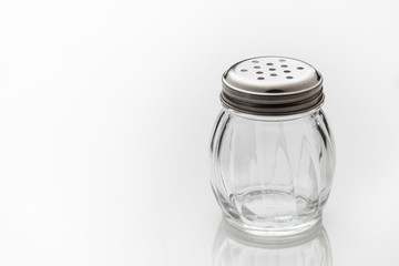 Empty shaker jar for grated cheese or pepper.