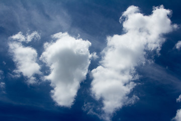 white clouds against blue sky.