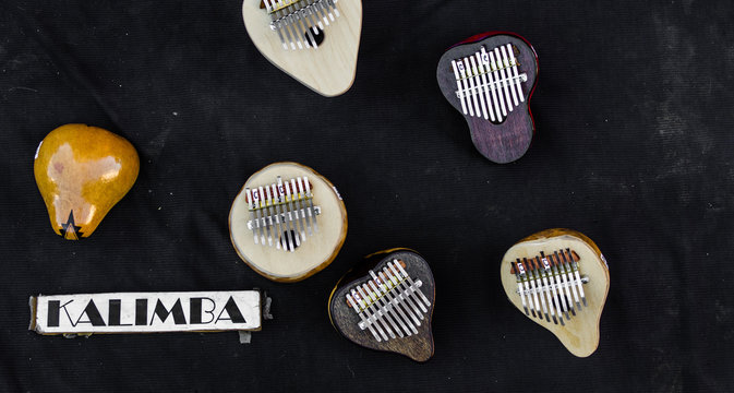 Kalimba musical instruments (mbira, sanza) against black background
