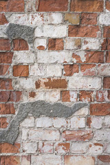 Old red brick wall with white plaster texture background