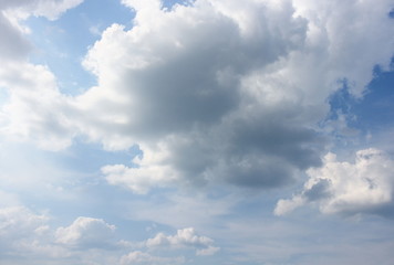 Naklejka na ściany i meble Blue sky with white clouds, and raincloud motion.