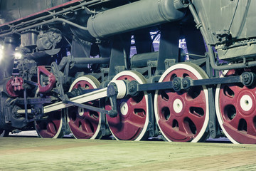 Wheels of locomotive in the night