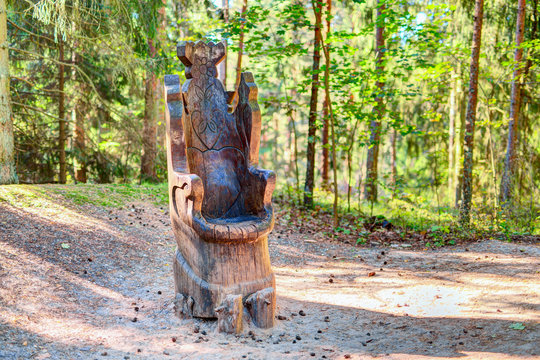 Old wooden sculptures in the forest. Witch Hill park, Lithuania.