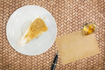 peanut meal cake with paper for note and pen