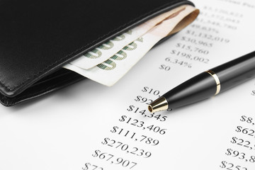 income analysis chart with wallet, pen and money
