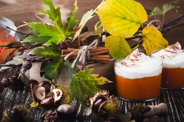 Gordijnen Homemade autumn dessert of pumpkin mousse with whipped cream © istetiana