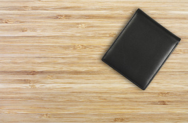 classic black wallet on top wood table