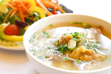 rice gruel or  rice congee mixed with meat with the salad