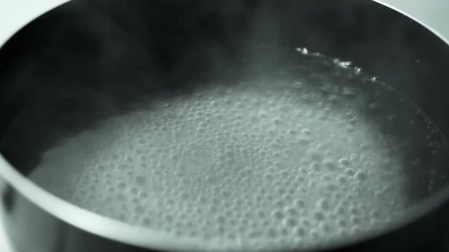 A close up of boiling water in a large pot. HD 1080.