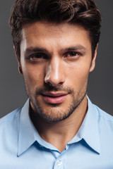 Close up portrait of a confident handsome man in shirt