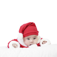cheerful child wearing santa claus suit and something stare for