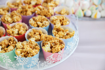 Homemade caramel popcorn in cupcake cups