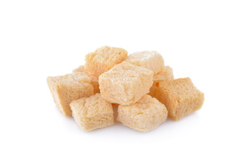 stack of croutons from white bread on white background