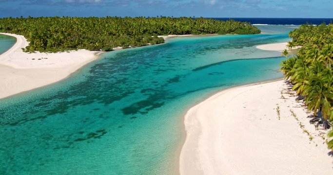 Aerial view of beautiful tropical island lagoon and white sand beach in the South Pacific