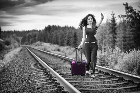 Monochromatic Concept Of Brunette Woman Running After Train