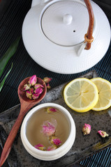 Obraz na płótnie Canvas Warm Rose Tea and Tea Pot