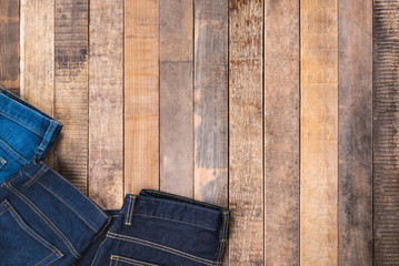 Fototapeta na wymiar Jeans on wood background