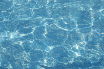 Blue water reflections in the outdoor pool.