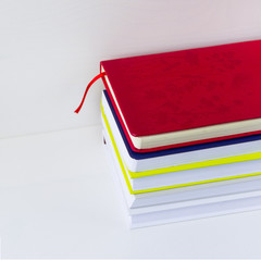 A stack of books on white background. Copy space for your text. Ideas for business and self-development