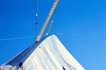 Backstay tense, A permanent backstay is attached to the top of the mast.