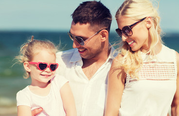 happy family in sunglasses on summer beach